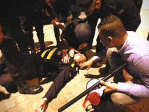 Jordanian security officer assisted during a protest in Amman