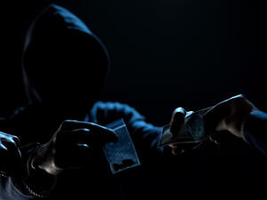 Police arresting drug dealer selling narcotic dopes to addict