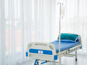 An empty hospital bed 