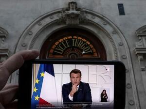 Macron via a smartphone 