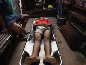 The body of Zaw Ko Latt, a protester shot dead is laid out on a stretcher in a vehicle in Mandalay 