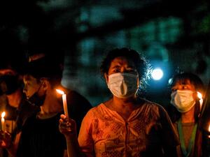  Protesters take part in a candlelight rally against the military coup in Yangon's Tamwe township