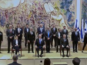 Israeli Prime Minister Benjamin Netanyahu (C) along with party leaders pose for a group photo at the Chagall Hall of Knesset following the swearing-in ceremony of Israel's 24th government