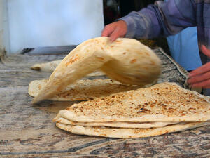 arab baker making arabic bread
