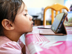 Young kids watching YouTube in smartphone gadget