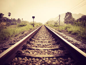 a viral TikTok of a man performing a dangerous stunt at a railroad 