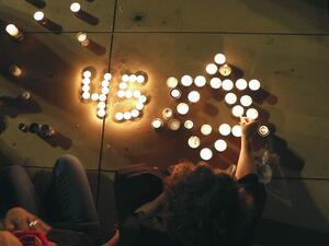 People light candles during a vigil in Habima Square in the Israeli coastal city of Tel Aviv 