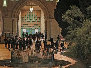 Israeli security forces clash with Palestinian protesters at the al-Aqsa mosque compound in Jerusalem