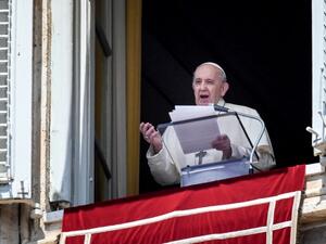 Pope Francis speaks from a window of the apostolic palace overlooking St. Peter's Square in the Vatican during the weekly Angelus prayer followed by the recitation of the Regina Coeli 