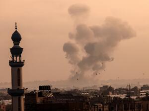 A fire billows from Israeli air strikes in Khan Yunis, in the southern Gaza Strip 
