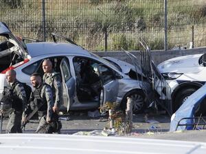 Israeli security forces inspect on May 16, 2021 the scene of a car-ramming attack which wounded several people, including four police officers, in the flashpoint Sheikh Jarrah neighbourhood of Israeli-annexed east Jerusalem. After the "vehicle-ramming attack" in the district, the scene of weeks of clashes between Palestinians and Israeli security forces, the assailant was "shot by officers", police spokesman Micky Rosenfeld said without giving details on the attacker's condition. 