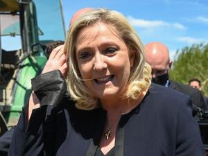 French far-right party of the National Rally (RN) President and Member of Parliament Marine Le Pen looks on in Saint-Gilles, south of France on May 20, 2021, during a visit to a wine and rice farm to show her support for the RN candidate Jean-Paul Garraud, head of the list for the regional elections in Occitanie