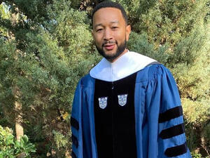 John  was handed an honorary degree 