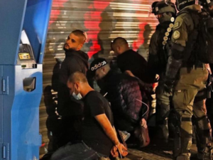 Israeli police arresting Palestinians