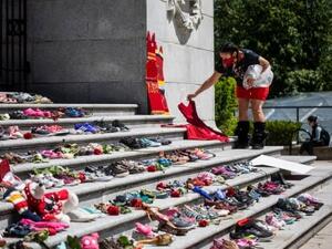 Remains of 215 children found buried at former Canadian residential school