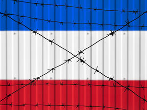 National flag of France on fence