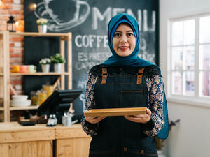 female muslim cafe worker 