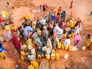 African people waiting to get in the water.