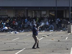 at least 10 killed in a stampede during mass looting in South Africa