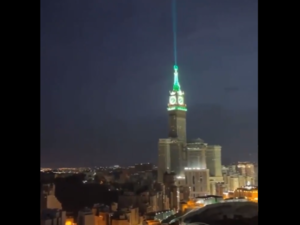 Makkah Royal Clock Tower in Saudi Arabia beaming light into the sky