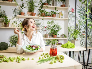 Young woman eating healthy food 