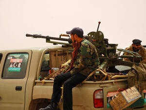 Libyan rebels travel to a battle line where they will fight 