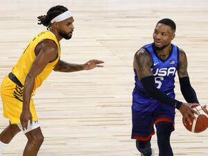 Damian Lillard #6 of the United States is guarded by Patty Mills #5 of the Australia Boomers during an exhibition game at Michelob Ultra Arena ahead of the Tokyo Olympic Games on July 12, 2021 in Las Vegas, Nevada. Australia defeated the United States 91-83. (Photo: AFP)