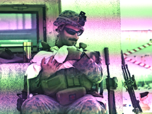 US Solider comforting an Afghan baby at Hamid Karzai International Airport in Kabul, Afghanistan.