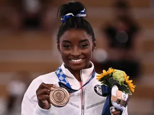 USA's Simone Biles poses with her bronze medal during the podium ceremony of the artistic gymnastics women's balance beam of the Tokyo 2020 Olympic Games at Ariake Gymnastics Centre in Tokyo on August 3, 2021. (Photo: AFP)