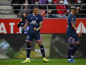 Paris Saint-Germain's French forward Kylian Mbappe celebrates scoring his team's first goal during the French L1 football match between Stade de Reims and Paris Saint-Germain (PSG) at Stade Auguste Delaune in Reims, northern France on August 29, 2021. (Photo by FRANCK FIFE / AFP)
