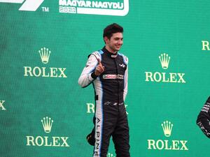 (LtoR) Second placed Aston Martin's German driver Sebastian Vettel, winner Alpine's French driver Esteban Ocon and third placed Mercedes' British driver Lewis Hamilton celebrate on the podium after the Formula One Hungarian Grand Prix at the Hungaroring race track in Mogyorod near Budapest on August 1, 2021. (Photo: AFP)