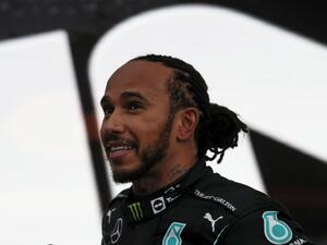 Mercedes' British driver Lewis Hamilton celebrates after winning the Formula One Russian Grand Prix at the Sochi Autodrom circuit in Sochi on September 26, 2021. (Photo: AFP)