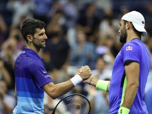 (L-R) Novak Djokovic of Serbia shakes hands with Matteo Berrettini of Italy at center court after Djokovic won their Men's Singles quarterfinal match on Day Ten of the 2021 US Open at the USTA Billie Jean King National Tennis Center on September 08, 2021 in the Flushing neighborhood of the Queens borough of New York City. (Photo: AFP)