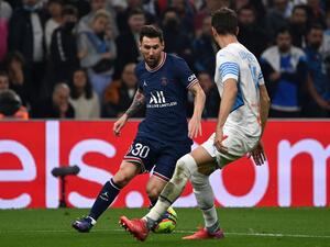 Paris Saint-Germain's Argentinian forward Lionel Messi runs with the ball next to Marseille's Brazilian defender Luan Peres during the French L1 football match between Olympique Marseille (OM) and Paris Saint-Germain's (PSG) at Stade Velodrome in Marseille, southern France, on October 24, 2021. (Photo: AFP)