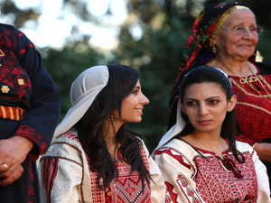 Palestinians in embroidered dresses 
