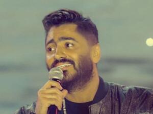 Tamer Hosny Hilariously Answers the Phone of a Fan's Friend on Stage (Video)