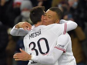 Paris Saint-Germain's French forward Kylian Mbappe is congratulated by Paris Saint-Germain's Argentinian forward Lionel Messi after scoring during the French L1 football match between Paris-Saint Germain (PSG) and Le Stade rennais Football Club at The Parc des Princes Stadium in Paris on February 11, 2022. (Photo by JULIEN DE ROSA / AFP) Paris Saint-Germain's French forward Kylian Mbappe is congratulated by Paris Saint-Germain's Argentinian forward Lionel Messi after scoring during the French L1 football match between Paris-Saint Germain (PSG) and Le Stade rennais Football Club at The Parc des Princes Stadium in Paris on February 11, 2022. (Photo by JULIEN DE ROSA / AFP)