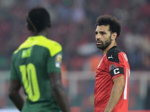 Egypt's forward Mohamed Salah (R) and Senegal's forward Sadio Mane look on during the Africa Cup of Nations (CAN) 2021 final football match between Senegal and Egypt at Stade d'Olembe in Yaounde on February 6, 2022. (Photo by Kenzo TRIBOUILLARD / AFP) Egypt's forward Mohamed Salah (R) and Senegal's forward Sadio Mane look on during the Africa Cup of Nations (CAN) 2021 final football match between Senegal and Egypt at Stade d'Olembe in Yaounde on February 6, 2022. (Photo by Kenzo TRIBOUILLARD / AFP)