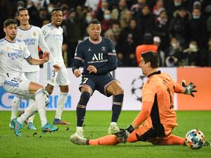 PSG's French forward Kylian Mbappe (C) shoots and scores a goal during the UEFA Champions League round of 16 first leg football match between PSG and Real Madrid at the Parc des Princes stadium in Paris on February 15, 2022. (Photo by Alain JOCARD / AFP) PSG's French forward Kylian Mbappe (C) shoots and scores a goal during the UEFA Champions League round of 16 first leg football match between PSG and Real Madrid at the Parc des Princes stadium in Paris on February 15, 2022. (Photo by Alain JOCARD / AFP)