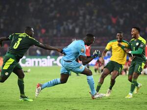 Senegal's goalkeeper Edouard Mendy (C) celebrates with teammates after winning the Africa Cup of Nations (CAN) 2021 final football match between Senegal and Egypt at Stade d'Olembe in Yaounde on February 6, 2022. (Photo by CHARLY TRIBALLEAU / AFP) Senegal's goalkeeper Edouard Mendy (C) celebrates with teammates after winning the Africa Cup of Nations (CAN) 2021 final football match between Senegal and Egypt at Stade d'Olembe in Yaounde on February 6, 2022. (Photo by CHARLY TRIBALLEAU / AFP)