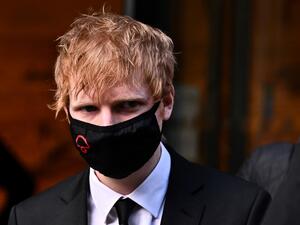 British singer-songwriter Ed Sheeran leaves from the Rolls Building of the High Court in London, on March 8, 2022 after attending the second day of a copyright trial over allegations that his hit song "Shape of You" has similarities to a song written by Sami Chokri and Ross O'Donoghue. (Photo by Ben Stansall / AFP) Ed Sheeran