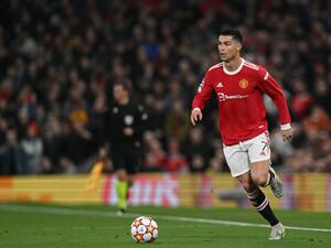 Manchester United's Portuguese striker Cristiano Ronaldo runs with the ball during the UEFA Champions League round of 16 second leg football match between Manchester United and Atletico Madrid at Old Trafford stadium in Manchester, north west England on March 15, 2022. (Photo by Paul ELLIS / AFP) Manchester United's Portuguese striker Cristiano Ronaldo runs with the ball during the UEFA Champions League round of 16 second leg football match between Manchester United and Atletico Madrid at Old Trafford stadium in Manchester, north west England on March 15, 2022. (Photo by Paul ELLIS / AFP)