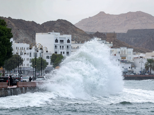 High waves break on the Mutrah seaside in Oman 