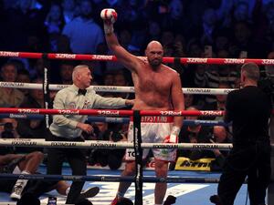  Britain's Tyson Fury (R) celebrates after knocking out Britain's Dillian Whyte in the sixth round to win their WBC heavyweight title fight at Wembley Stadium in west London, on April 23, 2022. Tyson Fury stopped British rival Dillian Whyte in the sixth round to retain his WBC heavyweight crown at a packed Wembley on Saturday. (Photo: AFP)
