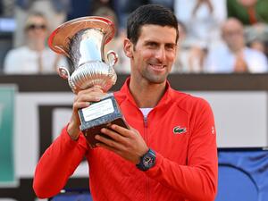 Serbia's Novak Djokovic holds the winner's trophy after winning the final match of the Men's ATP Rome Open tennis tournament against Greece's Stefanos Tsitsipas on May 15, 2022 at Foro Italico in Rome. (Photo by Andreas SOLARO / AFP) Serbia's Novak Djokovic holds the winner's trophy after winning the final match of the Men's ATP Rome Open tennis tournament against Greece's Stefanos Tsitsipas on May 15, 2022 at Foro Italico in Rome. (Photo by Andreas SOLARO / AFP)