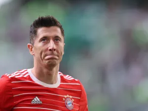 Bayern Munich's Polish forward Robert Lewandowski reacts after the German first division Bundesliga football match VfL Wolfsburg v Bayern Munich in Wolfsburg, northern Germany, on May 14, 2022. (Photo by Ronny Hartmann / AFP) 