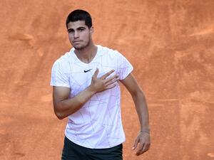 Spain's Carlos Alcaraz celebrates after beating Spain's Rafael Nadal during their 2022 ATP Tour Madrid Open tennis tournament singles quarter-final match at the Caja Magica in Madrid on May 6, 2022. (Photo by OSCAR DEL POZO / AFP) Spain's Carlos Alcaraz celebrates after beating Spain's Rafael Nadal during their 2022 ATP Tour Madrid Open tennis tournament singles quarter-final match at the Caja Magica in Madrid on May 6, 2022. (Photo by OSCAR DEL POZO / AFP)