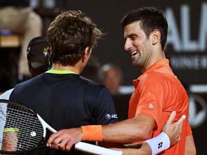 Serbia's Novak Djokovic (R) and Norway's Casper Ruud embrace after Djokovic won their semifinal match at the ATP Rome Open tennis tournament on May 14, 2022 at Foro Italico in Rome. (Photo by Andreas SOLARO / AFP) Serbia's Novak Djokovic (R) and Norway's Casper Ruud embrace after Djokovic won their semifinal match at the ATP Rome Open tennis tournament on May 14, 2022 at Foro Italico in Rome. (Photo by Andreas SOLARO / AFP)