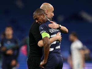 Manchester City's Spanish manager Pep Guardiola (L) hugs Manchester City's Brazilian midfielder Fernandinho after the UEFA Champions League semi-final second leg football match between Real Madrid CF and Manchester City at the Santiago Bernabeu stadium in Madrid on May 4, 2022. Real Madrid won the match 3-1. (Photo by Paul ELLIS / AFP) Manchester City's Spanish manager Pep Guardiola (L) hugs Manchester City's Brazilian midfielder Fernandinho after the UEFA Champions League semi-final second leg football match between Real Madrid CF and Manchester City at the Santiago Bernabeu stadium in Madrid on May 4, 2022. Real Madrid won the match 3-1. (Photo by Paul ELLIS / AFP)