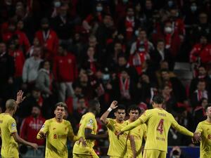 Liverpool's Colombian midfielder Luis Diaz (C) celebrates with teammates after scoring his team's third goal during the UEFA Champions League quarter final first leg football match between SL Benfica and Liverpool FC at the Luz stadium in Lisbon on April 5, 2022. (Photo by CARLOS COSTA / AFP) Liverpool's Colombian midfielder Luis Diaz (C) celebrates with teammates after scoring his team's third goal during the UEFA Champions League quarter final first leg football match between SL Benfica and Liverpool FC at the Luz stadium in Lisbon on April 5, 2022. (Photo by CARLOS COSTA / AFP)